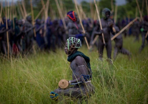 Suri tribe warriors fighting during a donga stick ritual, Omo valley, Tulgit, Ethiopia