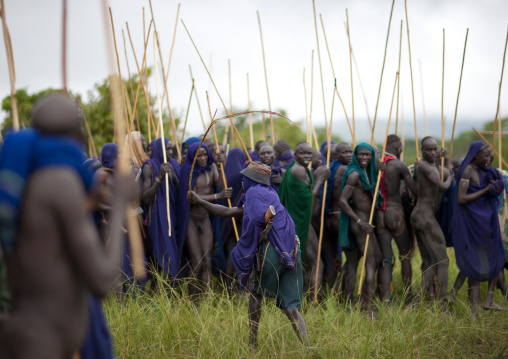 Suri tribe warriors fighting during a donga stick ritual, Omo valley, Tulgit, Ethiopia