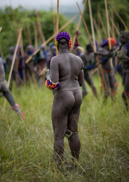 Suri tribe warriors fighting during a donga stick ritual, Omo valley, Tulgit, Ethiopia