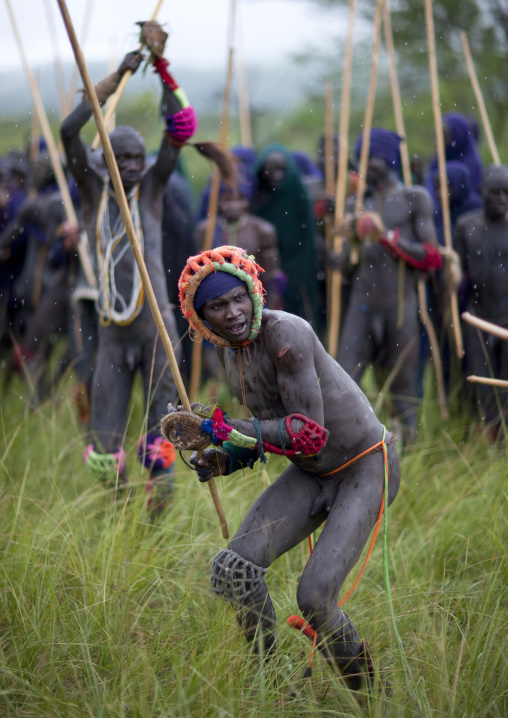 Suri tribe warriors fighting during a donga stick ritual, Omo valley, Tulgit, Ethiopia