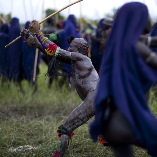 Suri tribe warriors fighting during a donga stick ritual, Omo valley, Tulgit, Ethiopia