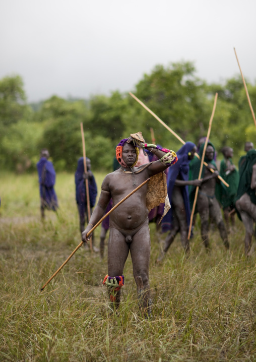 Suri tribe warriors fighting during a donga stick ritual, Omo valley, Tulgit, Ethiopia