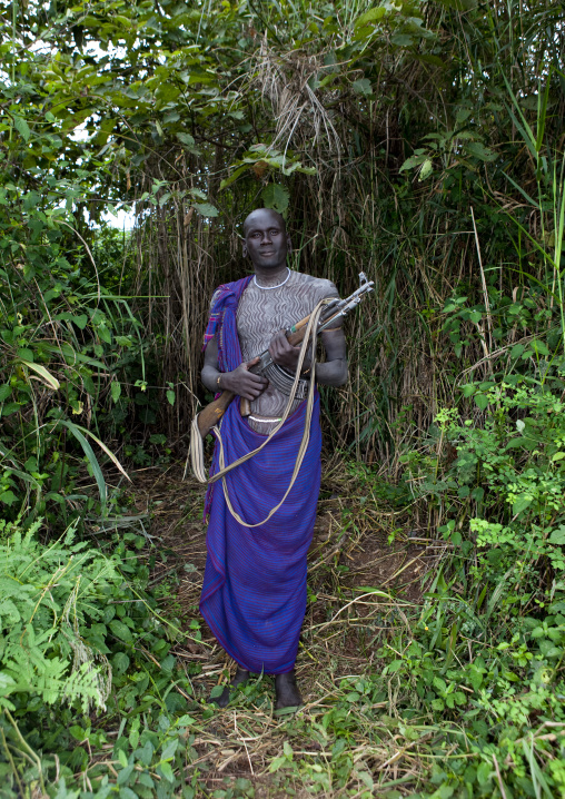 Suri Man Holding A Kalashnikov, Kibbish Village, Omo Valley, Ethiopia