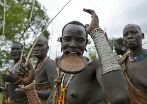 Surma Woman Wearing A Lip Plate And Copper Bracelets, Kibbish Village, Omo Valley, Ethiopia