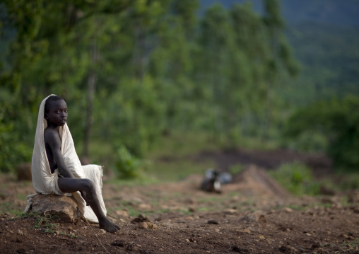 Suri Boy Sitting, Turgit Village, Omo Valley, Ethiopia