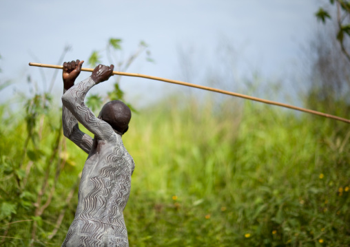 Surma warrior training with his stick, Turgit village, Omo valley, Ethiopia