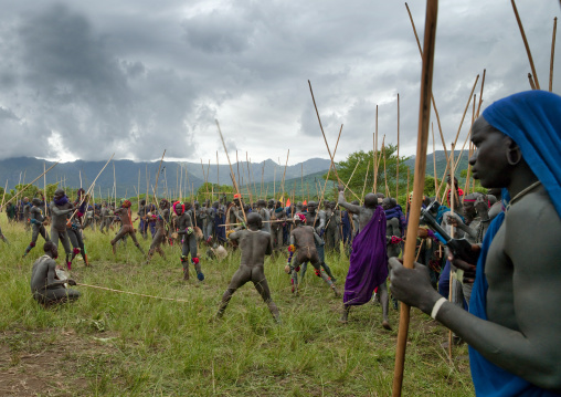 Suri tribe warriors fighting during a donga stick ritual, Omo valley, Tulgit, Ethiopia