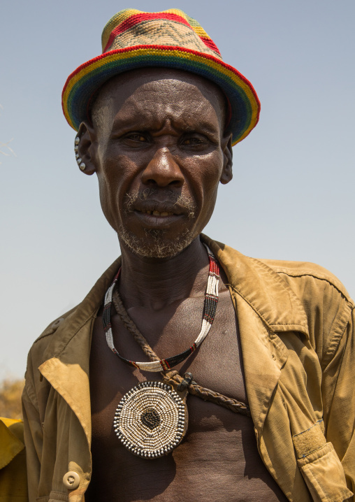 Man with a beaded pendant during the proud ox ceremony in Dassanech tribe, Turkana County, Omorate, Ethiopia