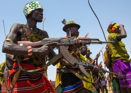 Men with weapons during the proud ox ceremony in the Dassanech tribe, Turkana County, Omorate, Ethiopia