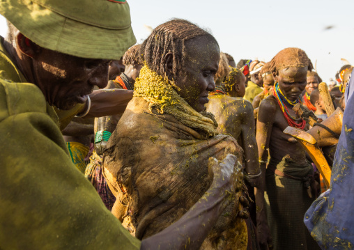 Old woman covering herself with the stomach of a cow during the proud ox ceremony in the Dassanech tribe, Turkana County, Omorate, Ethiopia