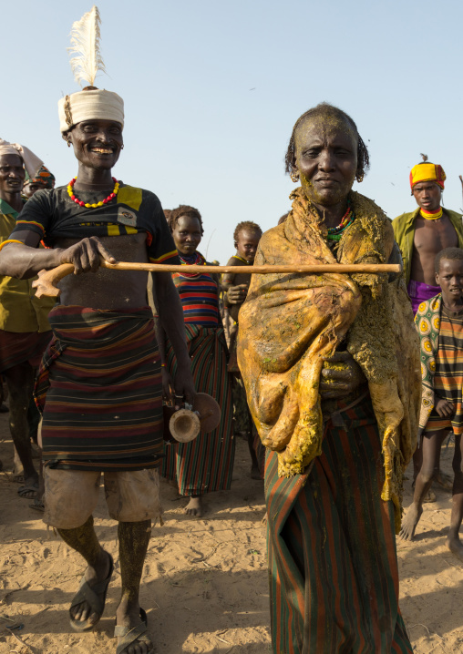 Old woman covering herself with the stomach of a cow during the proud ox ceremony in the Dassanech tribe, Turkana County, Omorate, Ethiopia
