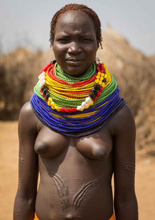 Nyangatom tribe woman with a huge necklace, Omo Valley, Kangate, Ethiopia