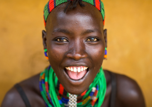 Portrait of a beautiful smiling Hamer tribe woman, Omo valley, Dimeka, Ethiopia