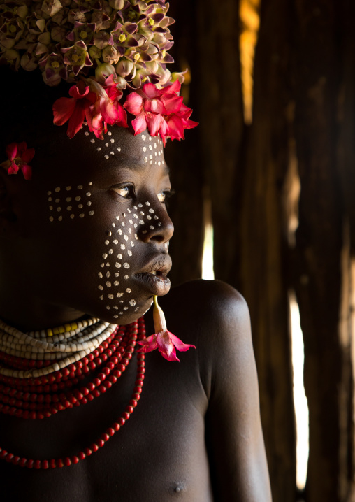 Karo tribe child with flowers decorations, Omo valley, Korcho, Ethiopia