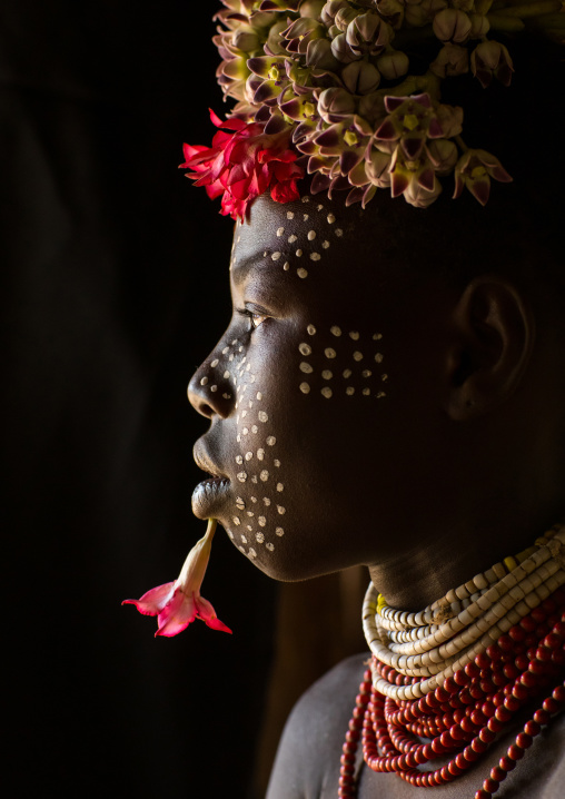 Karo tribe child with flowers decorations, Omo valley, Korcho, Ethiopia