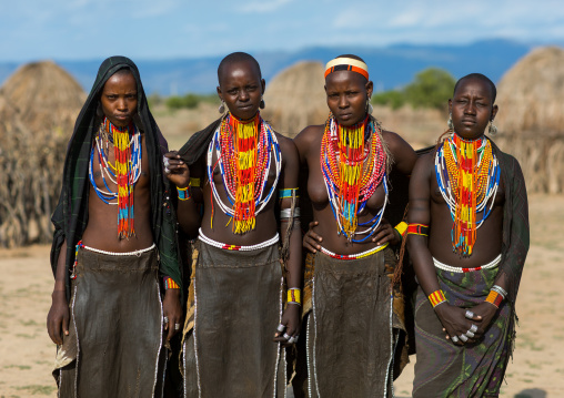 Portrait of Erbore tribe women with black veils and colourful necklaces, Omo valley, Murale, Ethiopia