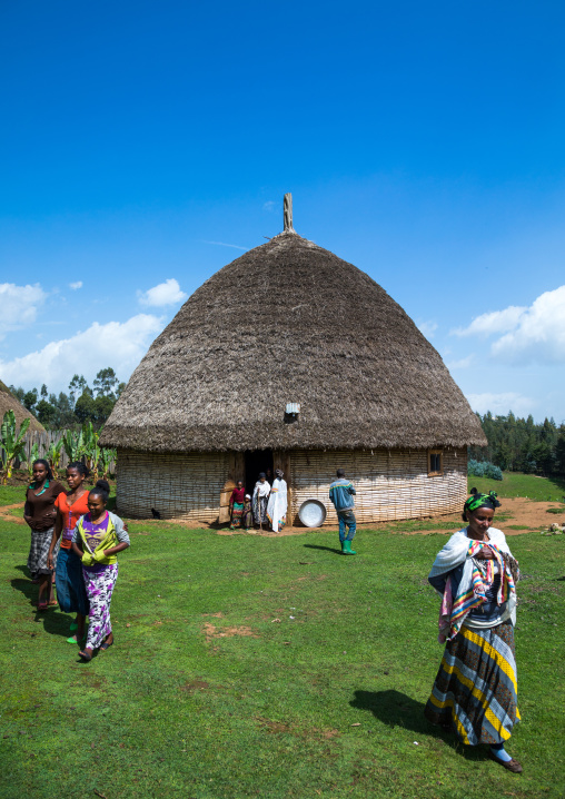 People in front of a Gurage traditional house with thatched roof, Gurage Zone, Butajira, Ethiopia