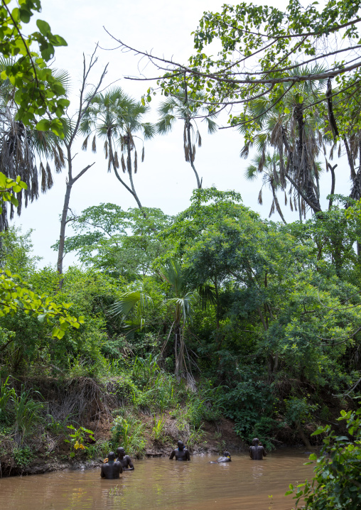 Bodi tribe fat men taking a bath before the Kael ceremony, Omo valley, Hana Mursi, Ethiopia