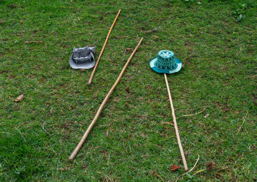 Sticks and hats on the ground let by men who entered a house, Gamo Gofa Zone, Ganta, Ethiopia