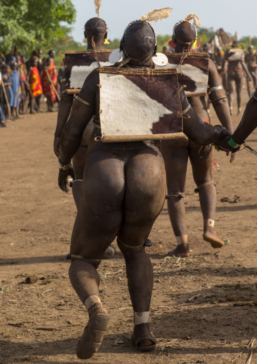 Bodi tribe fat men dancing during Kael ceremony, Omo valley, Hana Mursi, Ethiopia