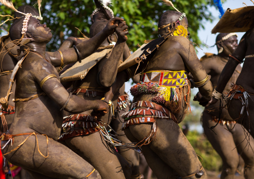Bodi tribe fat men dancing during Kael ceremony, Omo valley, Hana Mursi, Ethiopia