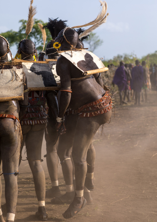 Bodi tribe fat men dancing during Kael ceremony, Omo valley, Hana Mursi, Ethiopia