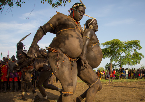 Bodi tribe fat men running during Kael ceremony, Omo valley, Hana Mursi, Ethiopia