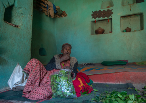 Harari man chewing khat inside an old house, Harari Region, Harar, Ethiopia