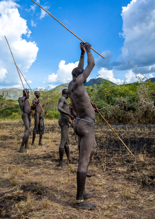 Suri tribe warriors parading before a donga stick fighting ritual, Omo valley, Kibish, Ethiopia