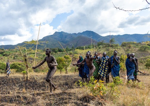 Suri tribe warriors parading before a donga stick fighting ritual, Omo valley, Kibish, Ethiopia