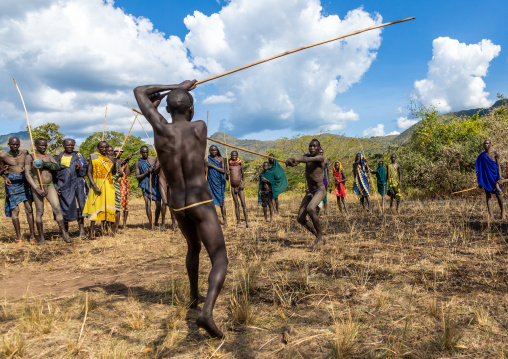 Suri tribe warriors fighting during a donga stick ritual, Omo valley, Kibish, Ethiopia