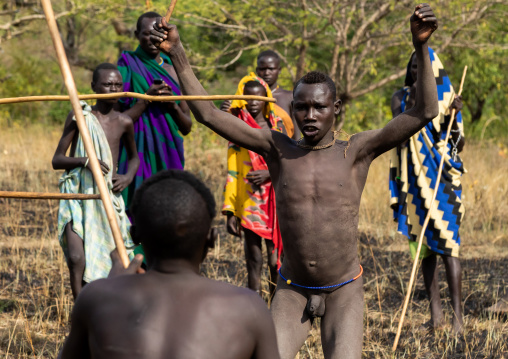 Suri tribe warriors fighting during a donga stick ritual, Omo valley, Kibish, Ethiopia