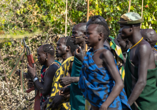 Suri tribe warriors parading before a donga stick fighting ritual, Omo valley, Kibish, Ethiopia