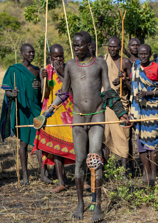Group of suri tribe warriors during a donga stick fighting ritual, Omo valley, Kibish, Ethiopia