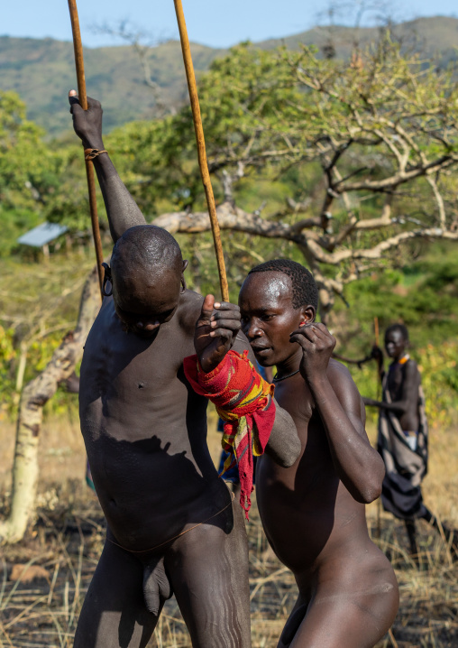Suri tribe warriors fighting during a donga stick ritual, Omo valley, Kibish, Ethiopia