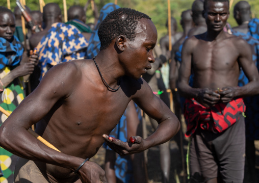 Suri tribe warriors parading before a donga stick fighting ritual, Omo valley, Kibish, Ethiopia