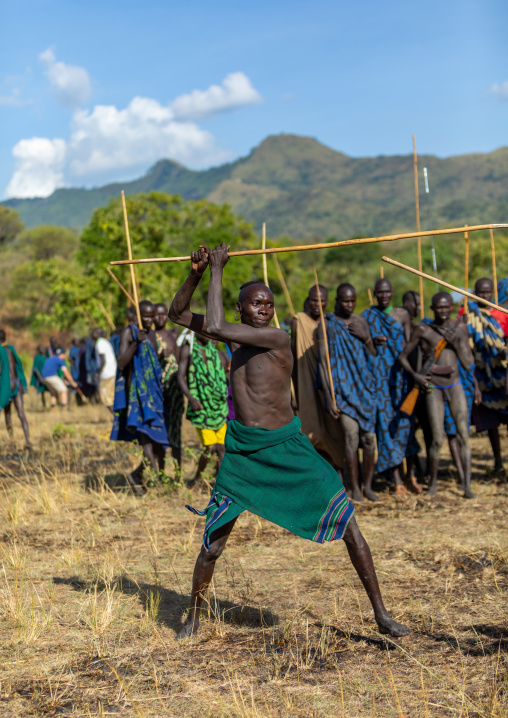 Suri tribe warriors fighting during a donga stick ritual, Omo valley, Kibish, Ethiopia