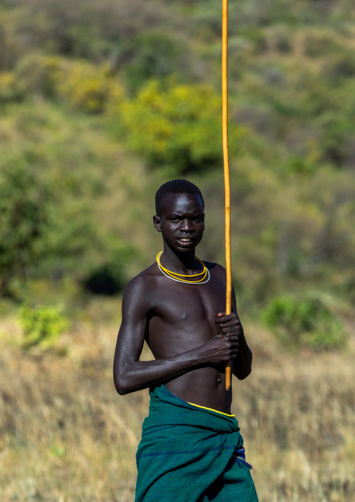 Suri tribe warrior during a donga stick fighting ritual, Omo valley, Kibish, Ethiopia