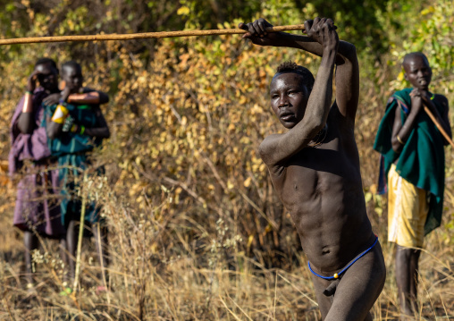 Suri tribe warriors fighting during a donga stick ritual, Omo valley, Kibish, Ethiopia
