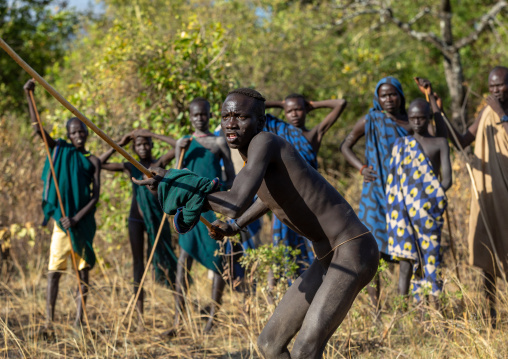 Suri tribe warriors fighting during a donga stick ritual, Omo valley, Kibish, Ethiopia