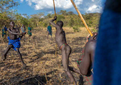 Suri tribe warriors fighting during a donga stick ritual, Omo valley, Kibish, Ethiopia