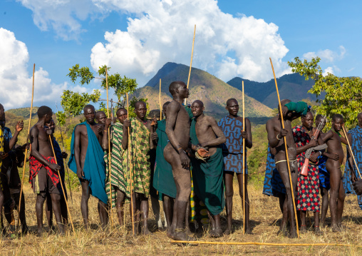 Group of suri tribe warriors during a donga stick fighting ritual, Omo valley, Kibish, Ethiopia