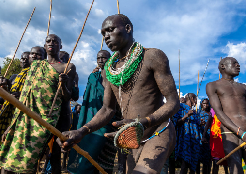 Suri tribe warriors parading before a donga stick fighting ritual, Omo valley, Kibish, Ethiopia