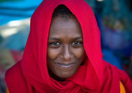 Oromo teenage girl wearing a red veil, Amhara region, Senbete, Ethiopia