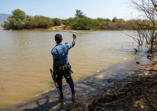 Ethiopian policeman in afambo lake, Afar Region, Afambo, Ethiopia