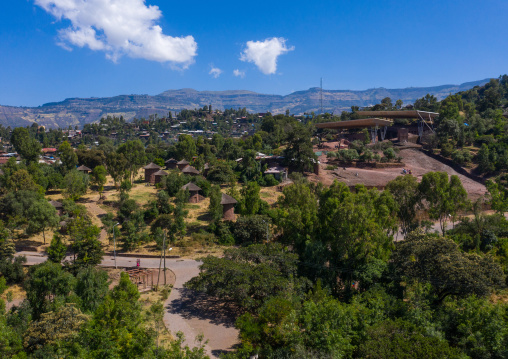 Protective shelters over a monolithic rock-cut church, Amhara Region, Lalibela, Ethiopia