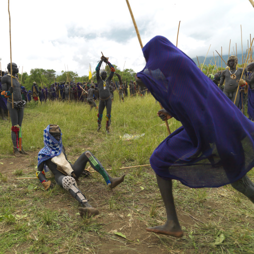 Suri tribe warriors fighting during a donga stick ritual, Omo valley, Tulgit, Ethiopia