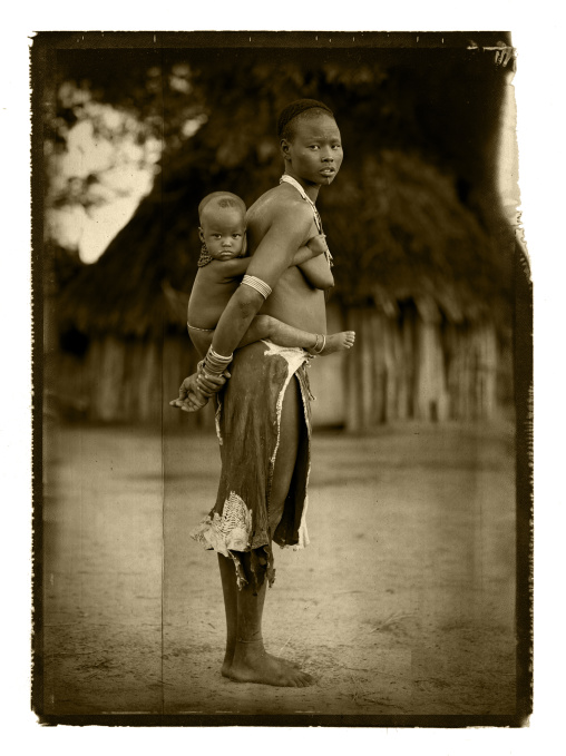 Karo Woman Carrying Baby In Her Arms Ethiopia
