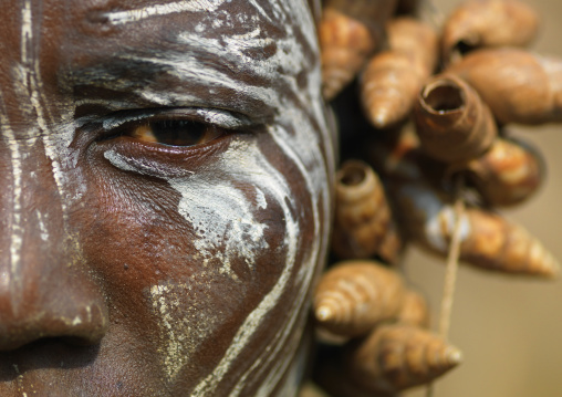 Detail Of A Mursi Woman Painted Face With Shell Headdress, Omo Valley, Ethiopia