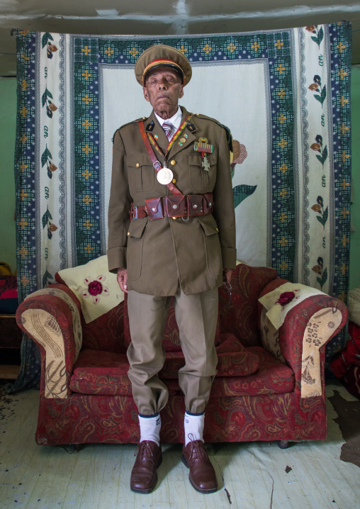 Ethiopian veteran from the italo-ethiopian war in army uniform in his home, Addis Ababa Region, Addis Ababa, Ethiopia